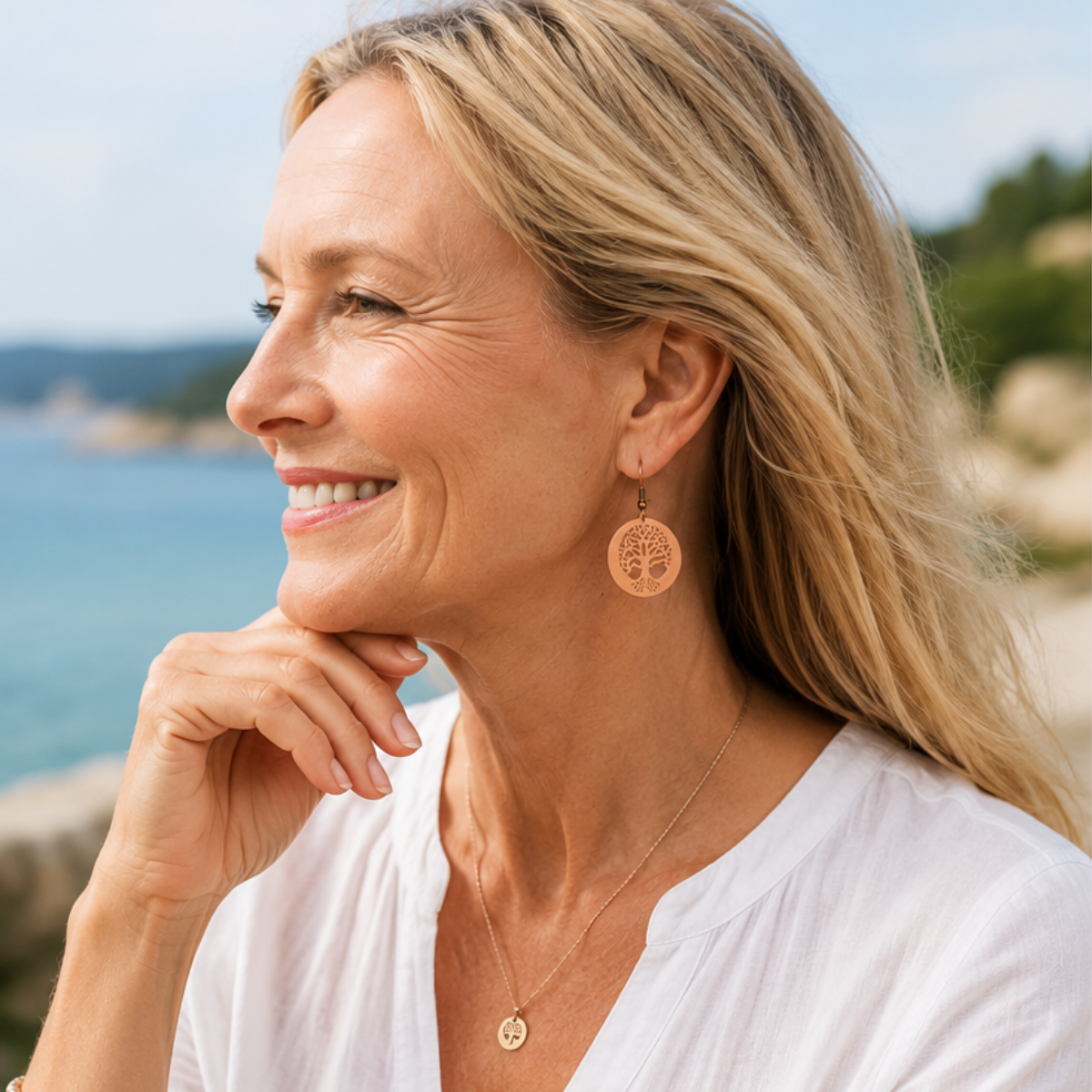 lady wearing tree of life earrings