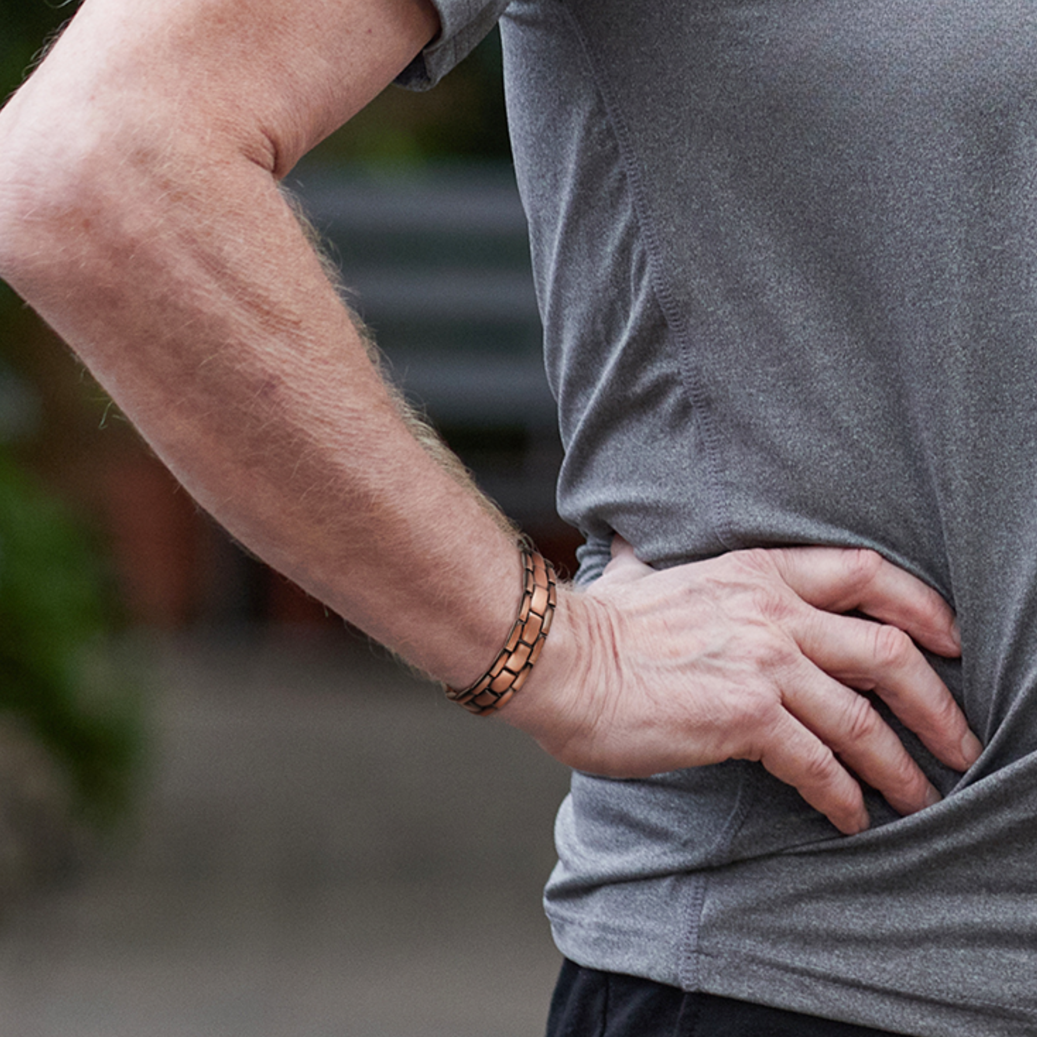 man wearing copper magnetic therapy bracelet on wrist